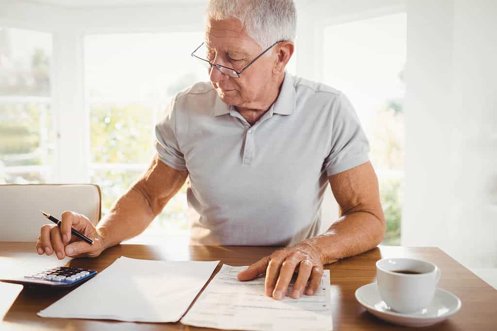 worried man preparing best tax deductions for 2022